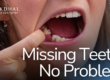 girl pointing to missing tooth